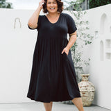 Model displaying women's plus size dress online - Ashleigh Dress in Black by Peach The Label